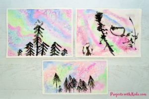 Create a beautiful northern lights watercolor painting using easy watercolor techniques that kids will love experimenting and having fun with!