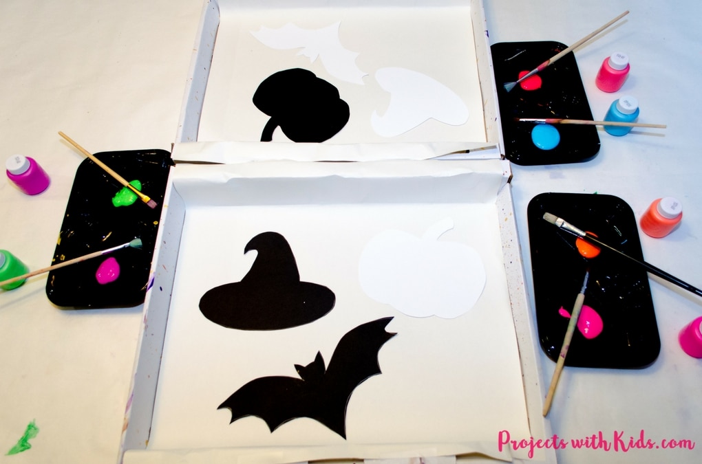 Take your Halloween decor to the next level with this neon splatter paint halloween banner with FREE printables! This is an easy and fun process art activity that kids of all ages will love. Check out the full post to get your FREE halloween silhouette printables!