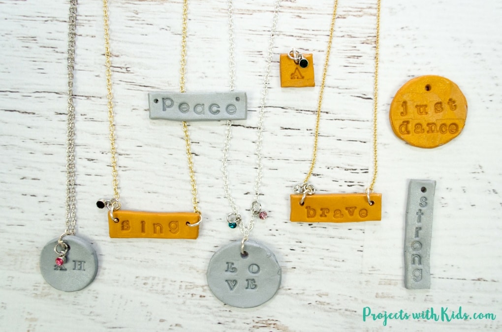 Learn how to make these stamped polymer clay necklaces that kids will have tons of fun making! These necklaces are sparkly and gorgeous and perfect for customizing, kids will love giving these as gifts and of course keeping some for themselves! Use initials, important dates, favorite hobbies, the possibilities are endless!
