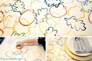 These fall placemats are the perfect project for younger kids! Cookie cutter process art turned into beautiful fall placemats for your holiday table. Kids will love exploring printing with cookie cutters.