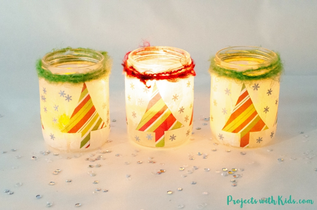 Start saving your jars, these magical Christmas lanterns are so fun and easy to make, you and your kids will want to make more than one!  They look absolutely stunning lit up with a candle inside and would make the perfect addition to any holiday decor. 