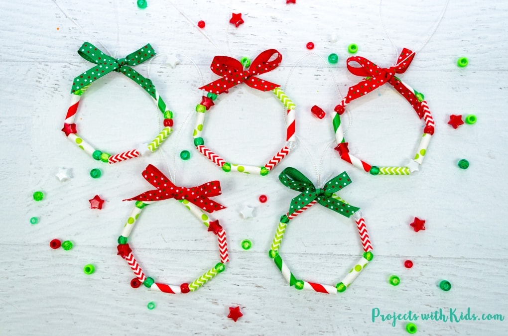 These wreath ornaments with paper straws are the perfect colorful addition to any Christmas tree. An easy and fun Christmas craft for kids of all ages. 