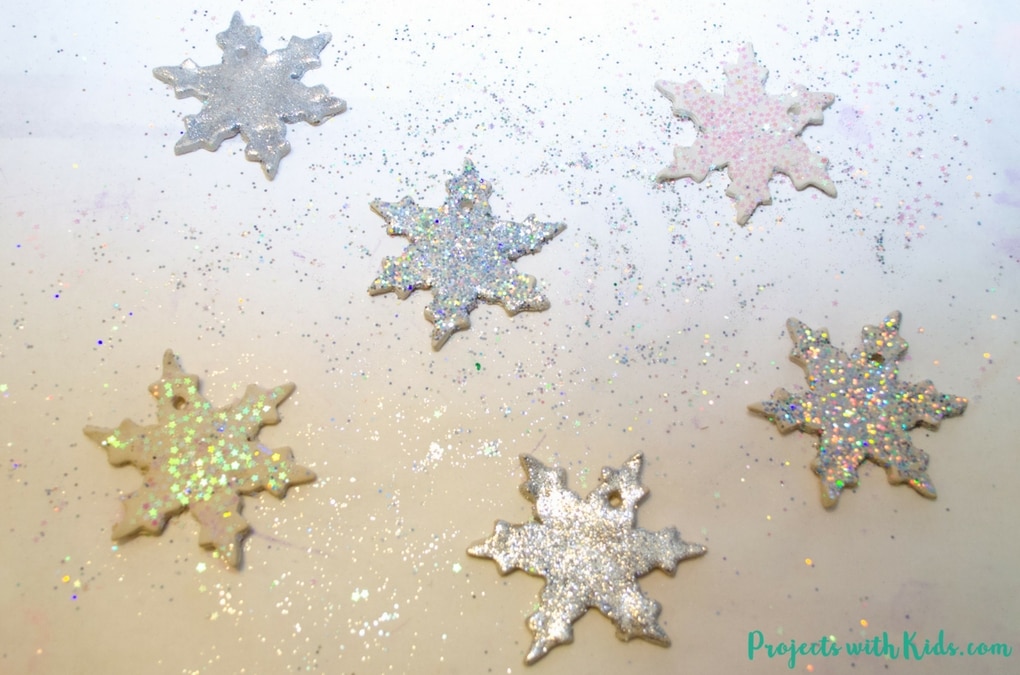 Add some sparkle and shine to your Christmas tree with these glitter snowflake ornaments. Super simple for kids of all ages to make. A beautiful addition to any Christmas tree and a great handmade gift for someone special. 