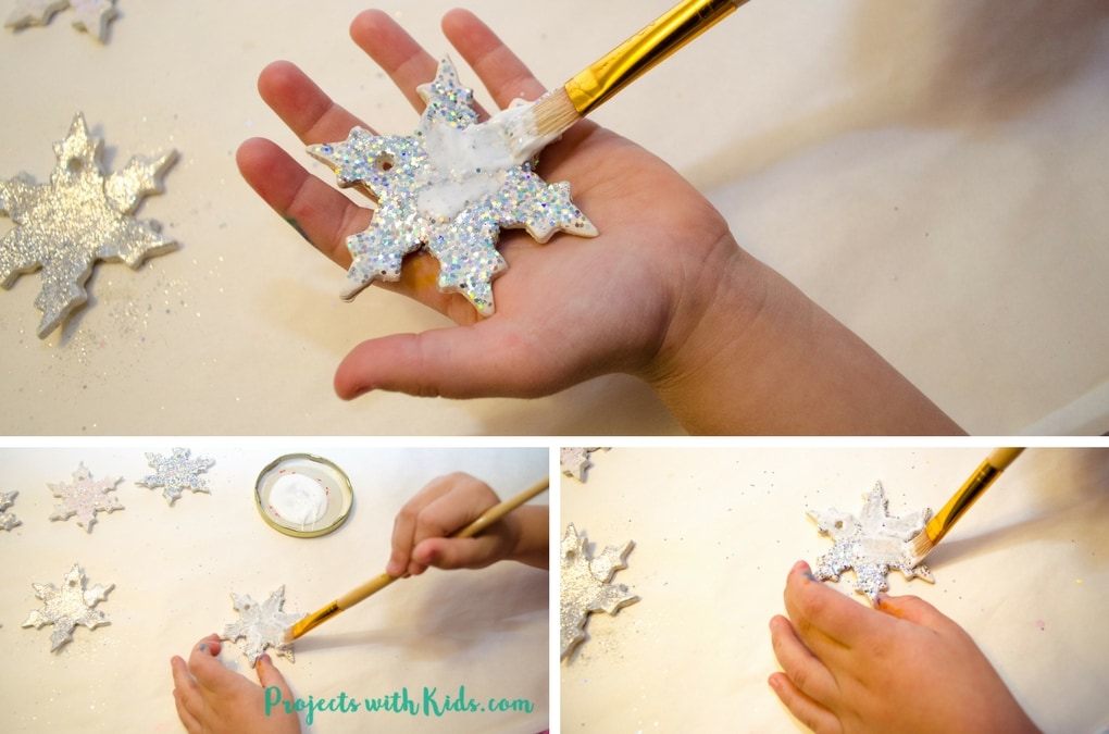 Add some sparkle and shine to your Christmas tree with these glitter snowflake ornaments. Super simple for kids of all ages to make. A beautiful addition to any Christmas tree and a great handmade gift for someone special. 