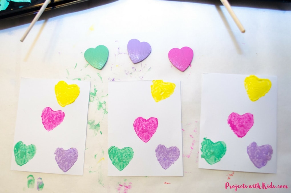 These conversation hearts cards and pins are so fun for kids to make! The perfect Valentine's Day craft and art project, kids will love making these cards and jewelry for their friends on Valentine's Day. 