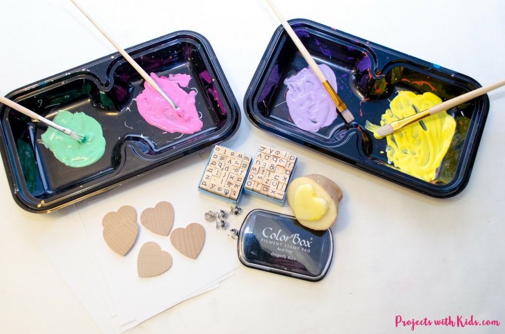 These conversation hearts cards and pins are so fun for kids to make! The perfect Valentine's Day craft and art project, kids will love making these cards and jewelry for their friends on Valentine's Day. 