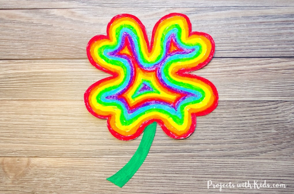 Brighten up your day with this easy rainbow shamrock craft using oil pastels. So fun and colorful, kids will love using vibrant oil pastels to create a rainbow in the shape of a shamrock. A great St. Patricks day craft project. Free printable template included!