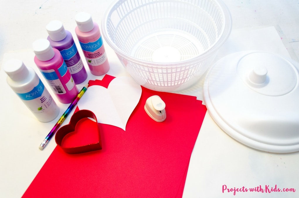 Spin painting hearts make the perfect Valentine's Day art project for kids. Kids will have a blast spinning their hearts and making cool patterns. An easy project for preschool kids to make on their own and an awesome process art project for kids of all ages!