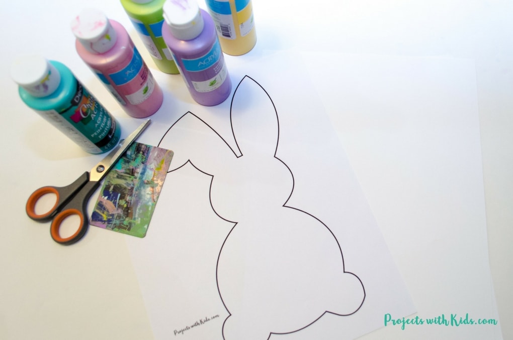 Scrape painting is a super fun process art activity that kids will love! Use beautiful spring colors to make these bunny silhouettes that are the perfect art project for spring or Easter. Edge them in gold glitter for an extra special touch! A great project for preschool aged kids and beyond. Free printable bunny template included.