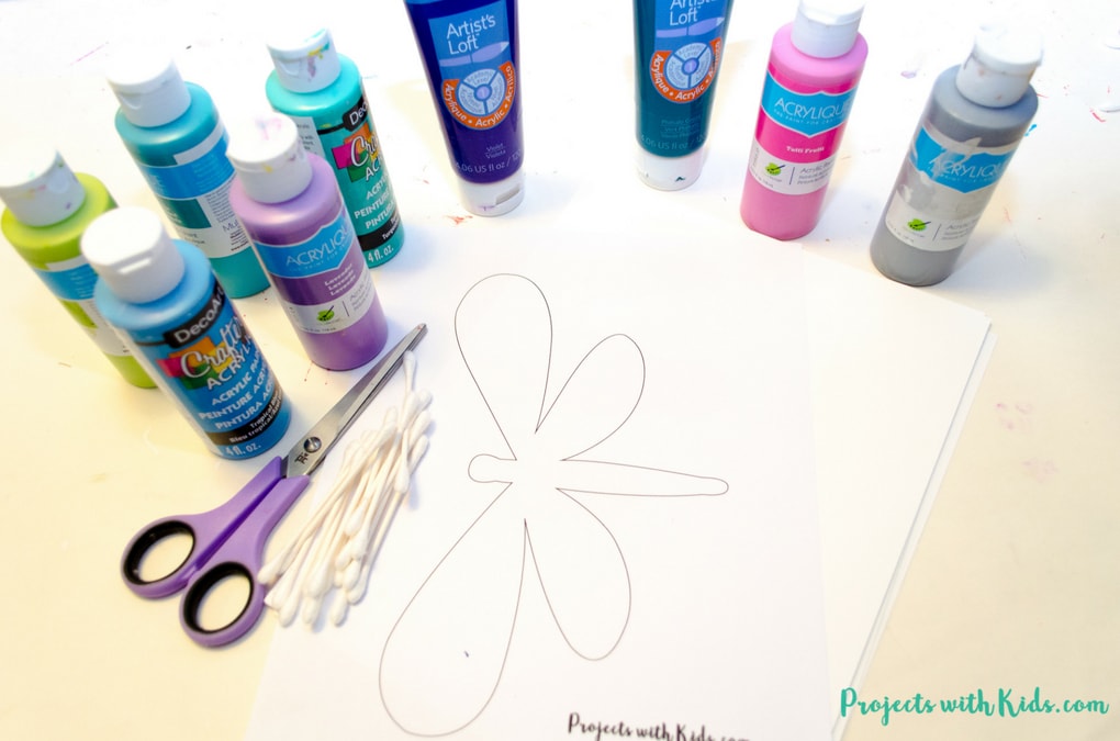 This q-tip painted dragonfly craft is a fun and easy summer activity for kids of all ages. Kids will have fun designing their dragonfly wings, each one will be unique and beautiful. This is a wonderful and relaxing painting project that is also great for working on fine motor skills. Free printable dragonfly template included! 
