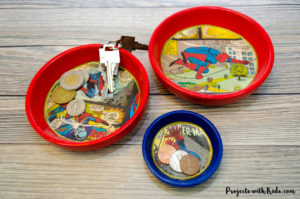 Give dad or grandpa a super place to put spare change, keys or desk clutter with this superhero trinket dish Father's Day craft and gift. Perfect for at the front door, on a dresser or at a desk. This superhero trinket dish is an awesome handmade gift that is sure to be a big hit! Kids will love making this craft for someone special.