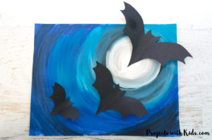 A full moon, spooky Halloween sky and flying bats come together to make this awesomely spooky Halloween art project that kids will love to create! Free bat templates included.