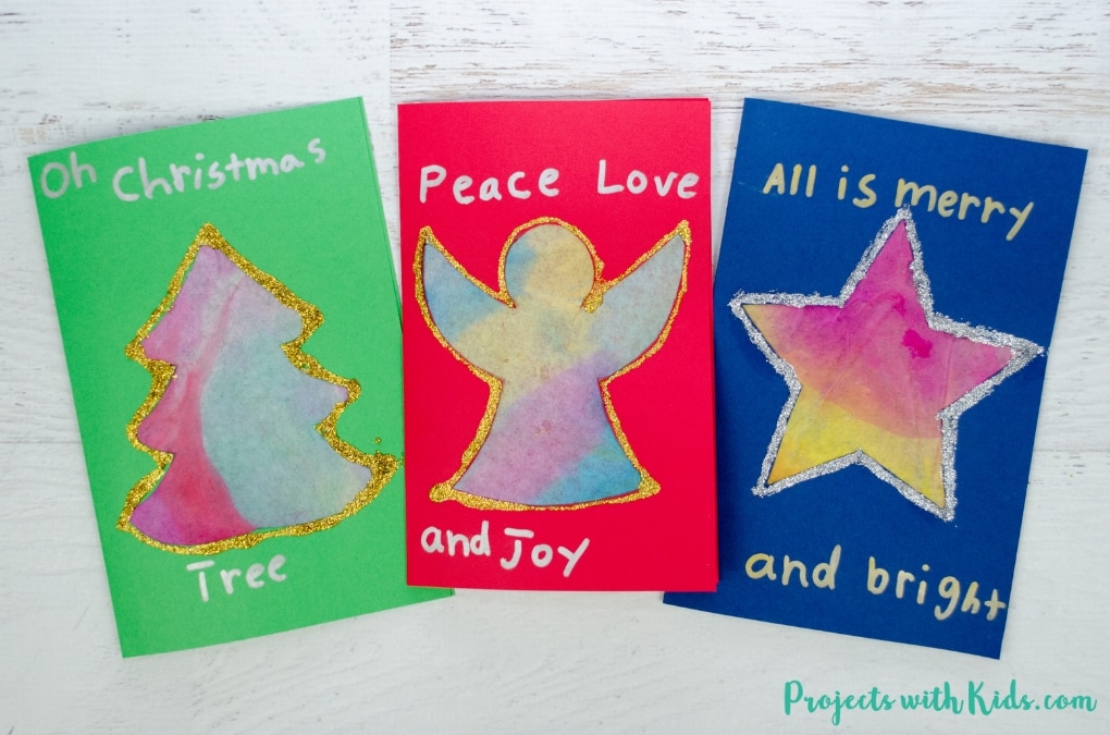 These kid made Christmas cards with coffee filters are colorful and glittery and super simple for kids to make. Free printable templates included.