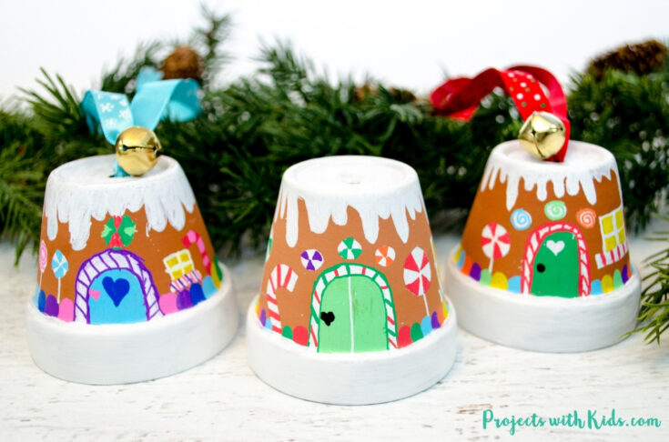 Transform mini terra cotta pots into the sweetest gingerbread house ornaments! Kids will love making this adorable Christmas craft to hang on the tree or give as a special gift.