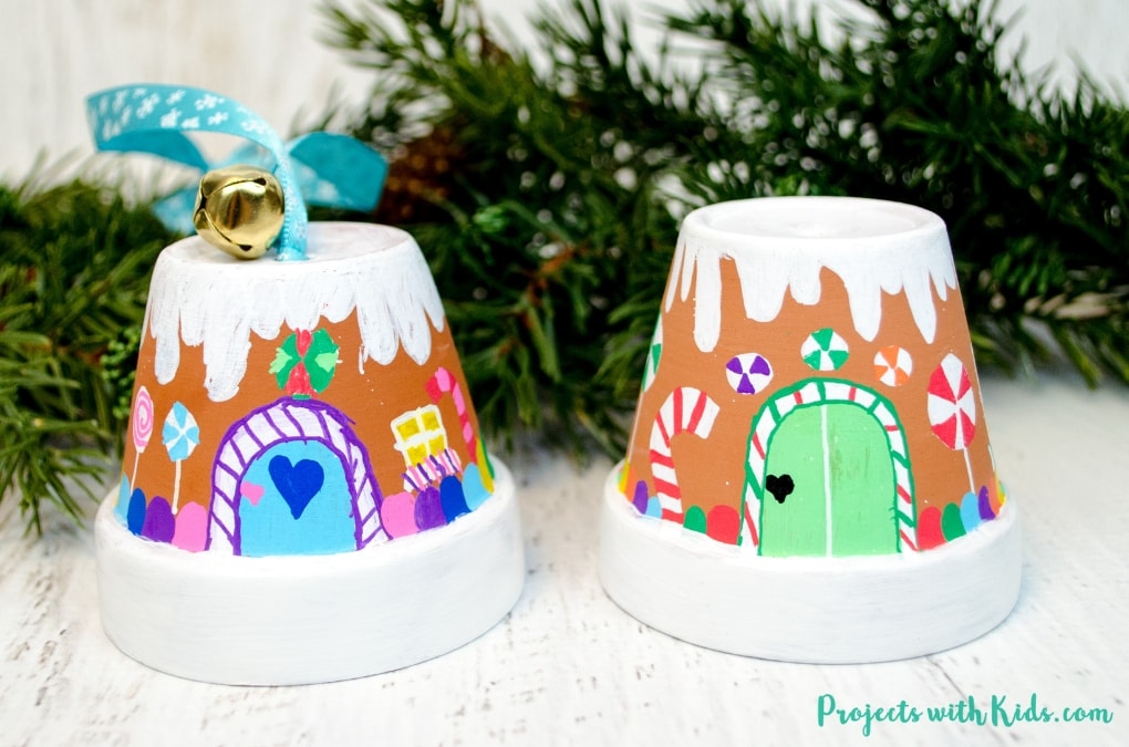 Transform mini terra cotta pots into the sweetest gingerbread house ornaments! Kids will love making this adorable Christmas craft to hang on the tree or give as a special gift. 
