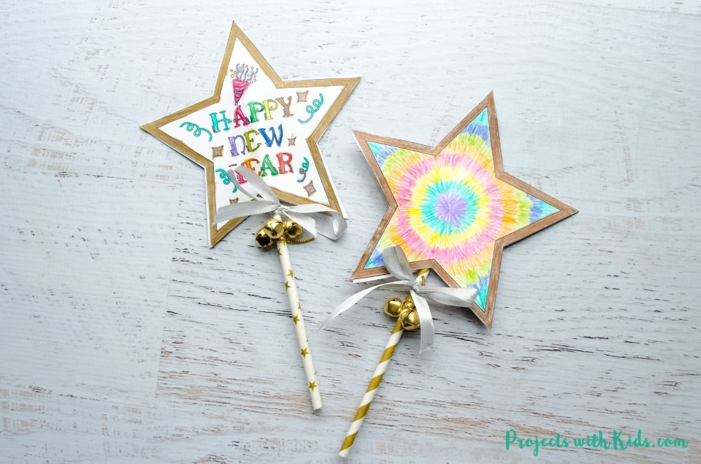 Ring in the New Year with this festive wand craft. An easy New Year's Eve craft that kids can also use as a noisemaker. 5 free printable designs to mix and match for kids to have fun with!