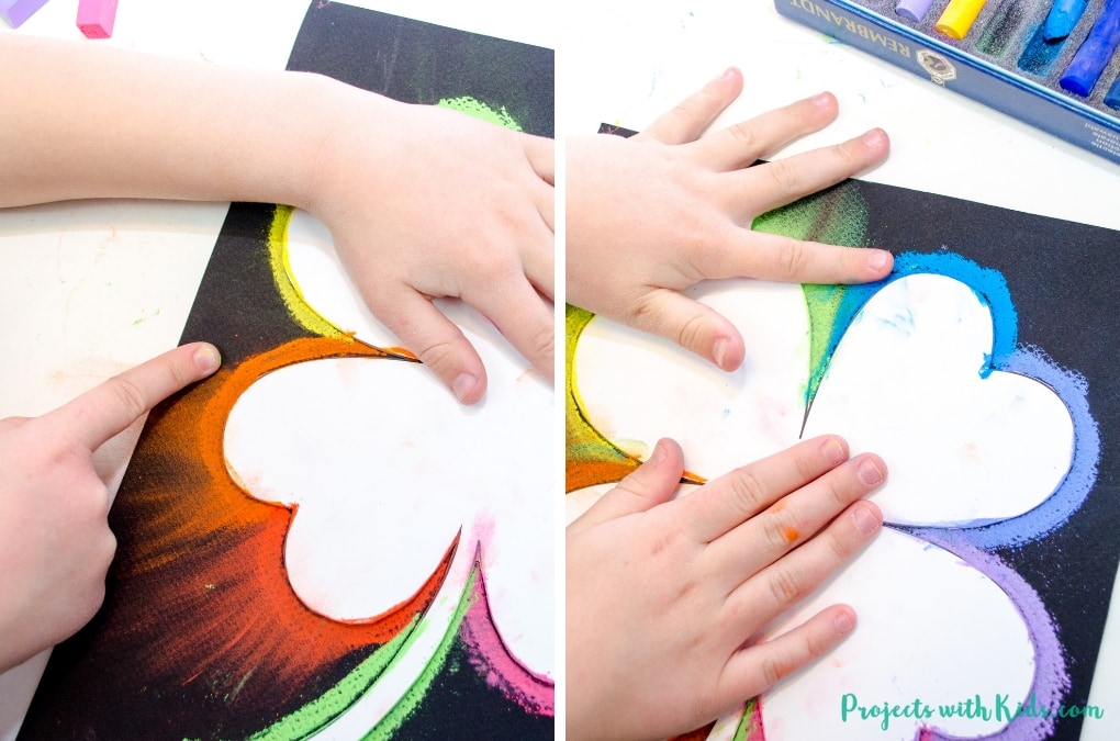 This shamrock art is beautiful and so fun for kids to make! Kids will love using this easy chalk pastel technique to create a brightly colored St. Patrick's Day craft. Free shamrock template included. 