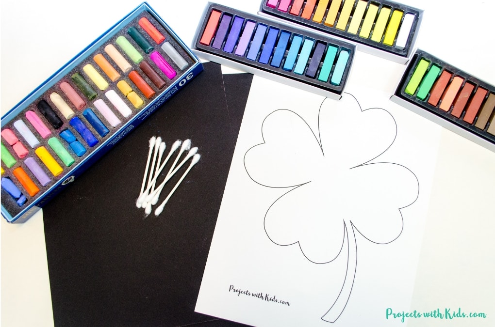 This shamrock art is beautiful and so fun for kids to make! Kids will love using this easy chalk pastel technique to create a brightly colored St. Patrick's Day craft. Free shamrock template included. 
