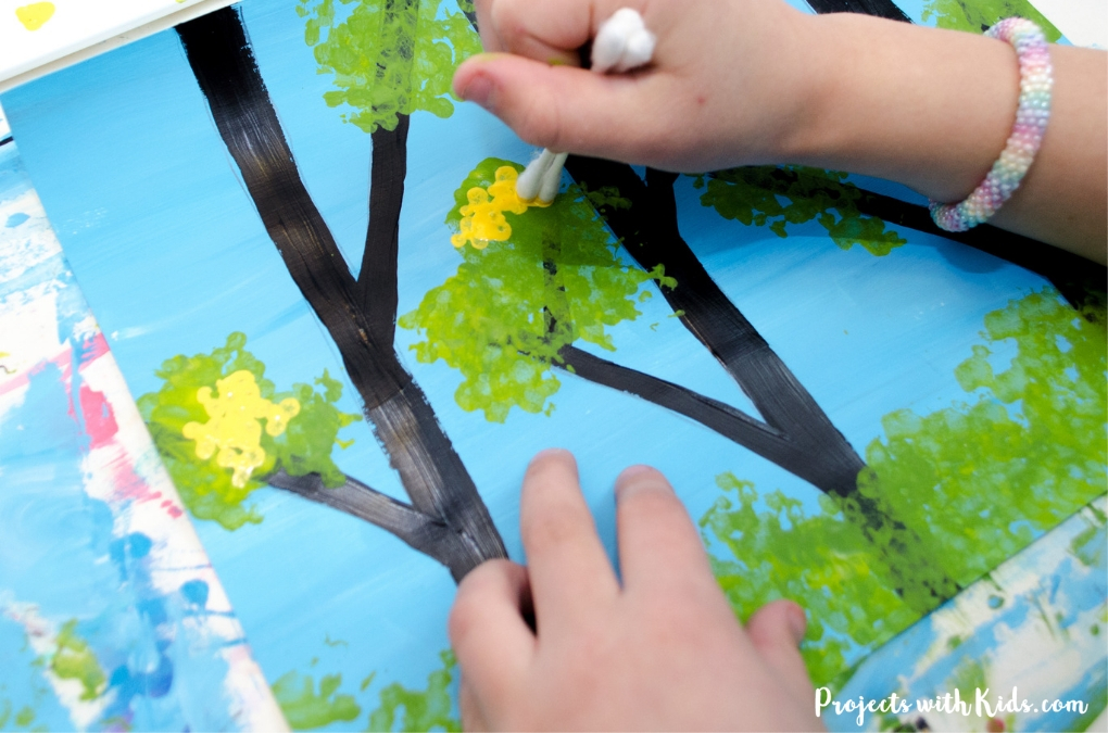 This gorgeous spring trees painting is so fun to make! Using bundled q-tips makes this an easy art project for kids of all ages. Free printable trees template included.