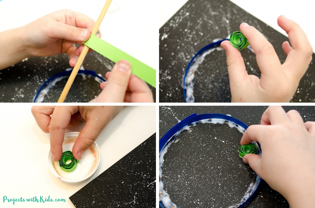 Celebrate Earth day with with this beautful paper quilled Earth Day craft for kids. Using black paper to create a night sky really makes this paper craft stand out! No special quilling tools needed. 