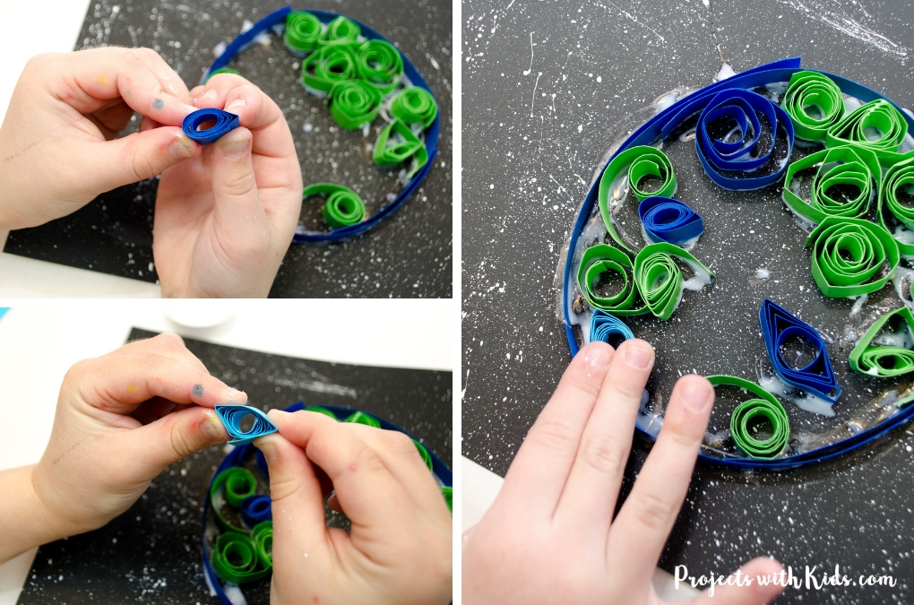 Kids will love to create this gorgeous earth day craft using simple quilling techniques with no special tools required. Using black paper and a starry sky really makes this art project stand out. 