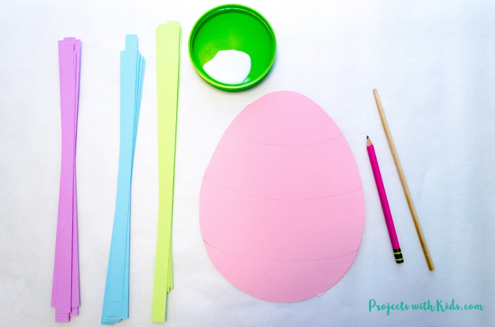 Kids can use easy paper quilling techniques to create this beautiful Easter egg paper craft! A fun easter craft activity that kids will love to create. Free egg template included. 