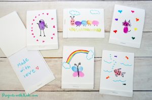 These DIY mini notebooks are absolutely adorable and using fingerprint art makes them the perfect handmade gift idea kids can make for Mother's Day, Father's Day or any occasion! Free notebook template included.