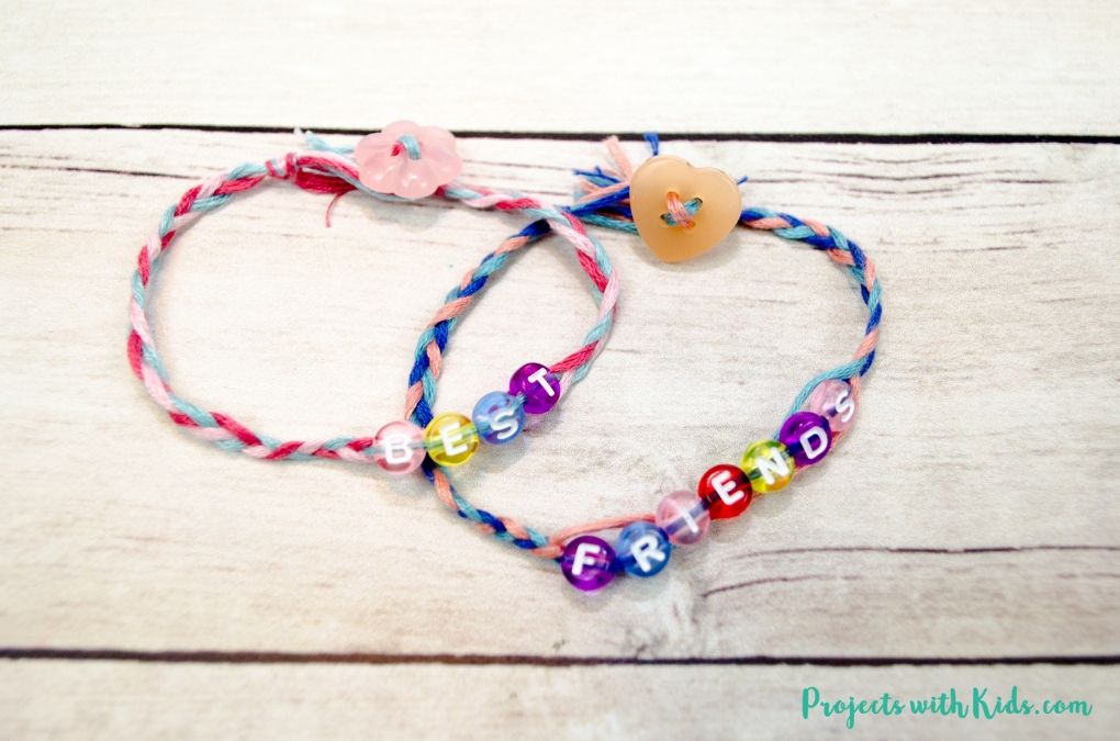 2 braided friendship bracelets that say best and friends. 