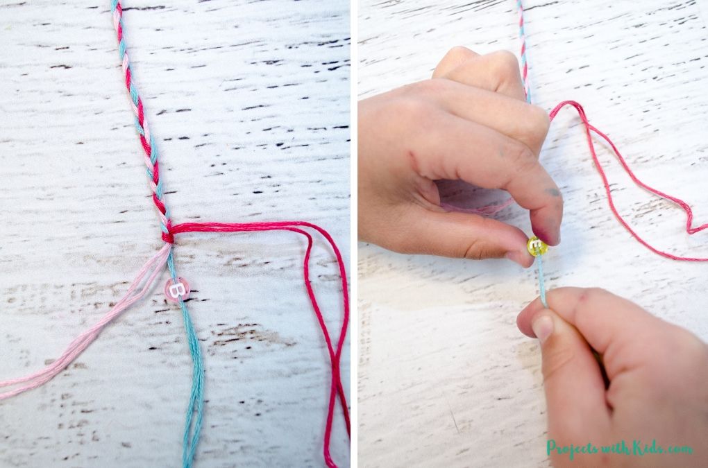 Someone threading a letter bead onto braided string.