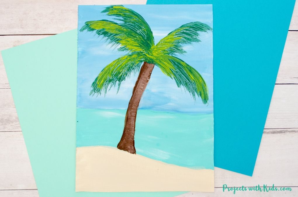 Palm tree painting on sand with water.