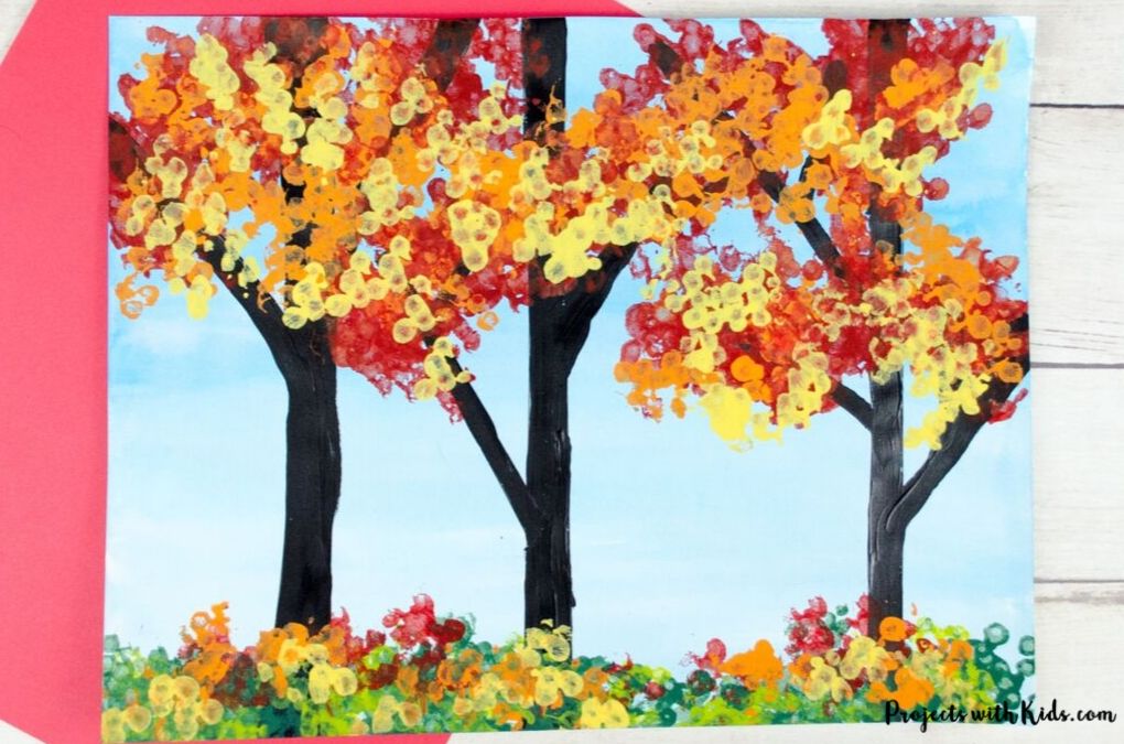 fall forest painting using bundled q-tips to create the leaves