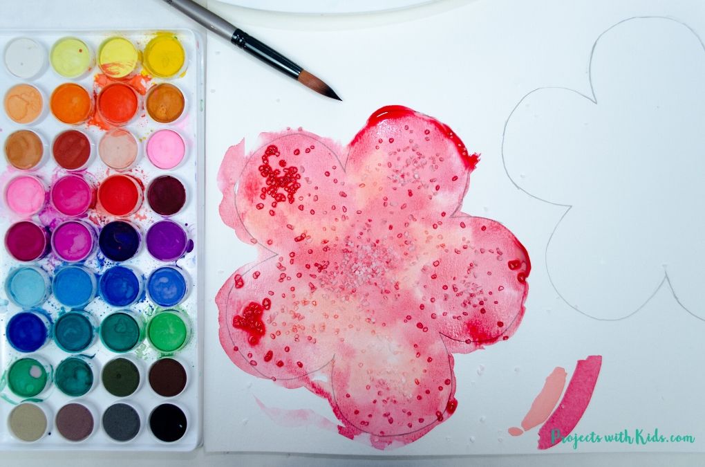 Salt sprinkled onto a wet watercolor poppy painting
