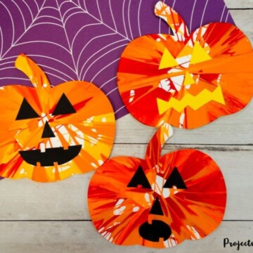 Pumpkin spin painting Halloween art project for kids