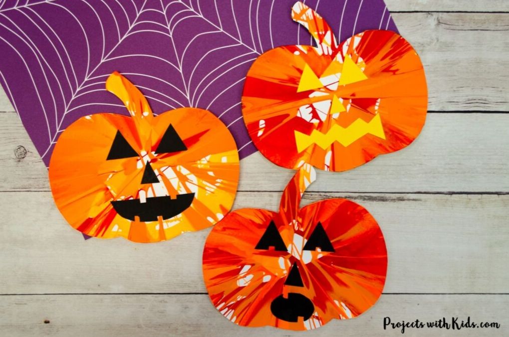 Pumpkin spin painting Halloween art project for kids