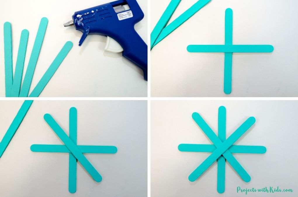 Using glue gun to four popsicle sticks into a snowflake.