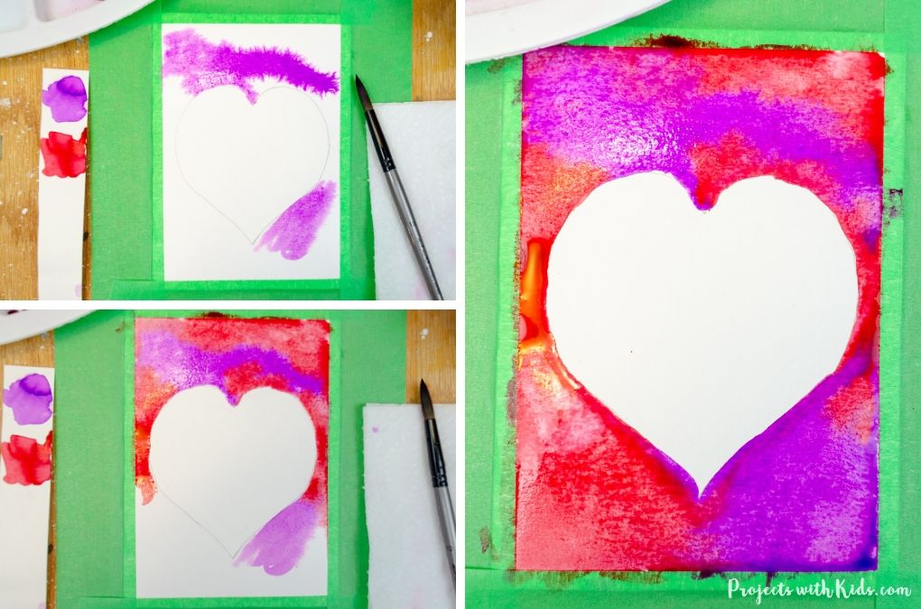 Painting with red and purple watercolors onto a Valentine's Day Card