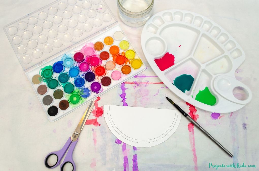 Watercolor paint, paint palette, scissors, paintbrush, watermelon template