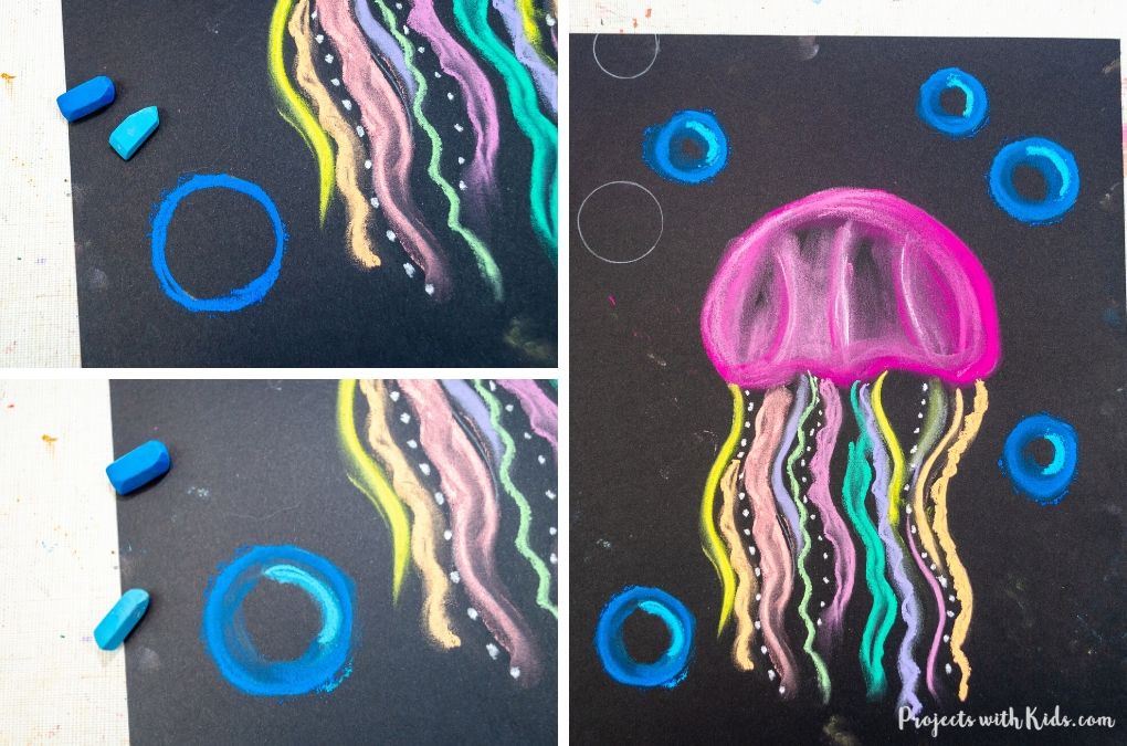 Drawing bubbles with chalk pastels for a jellyfish art project