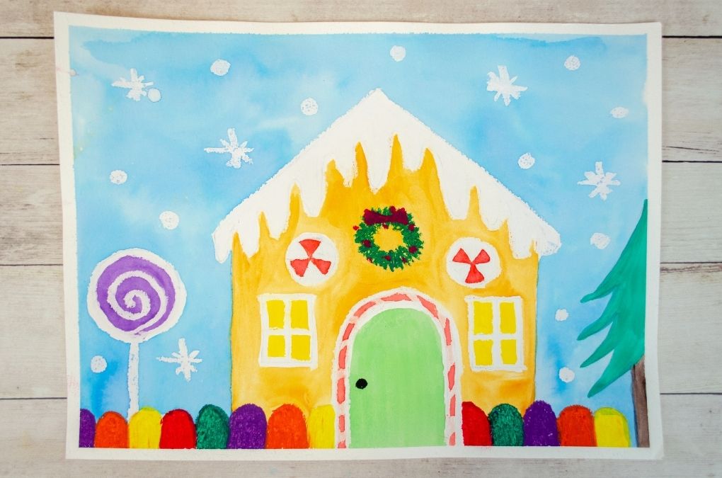 Gingerbread house painting art project for kids using watercolors and oil pastels.