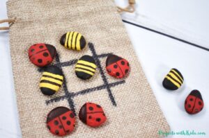 Tic tac toe craft with painted rocks for kids to make