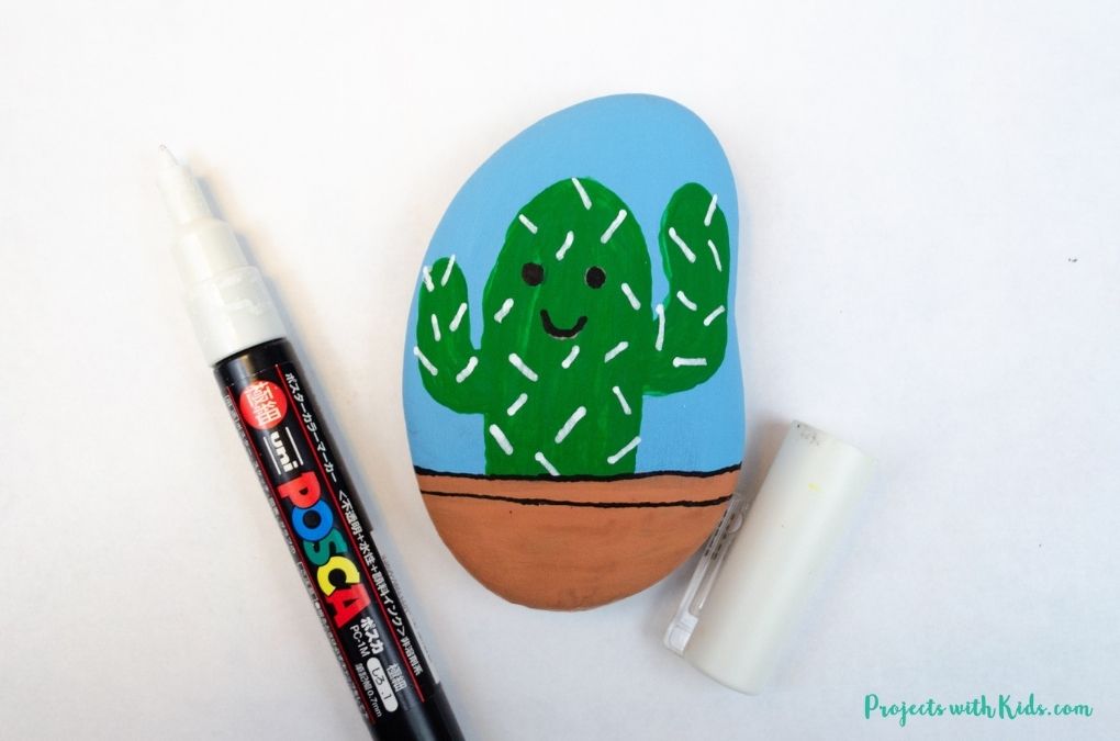 Cactus painted rock using paint pens