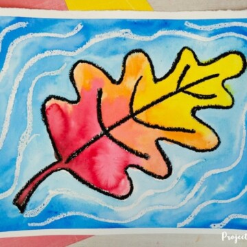 Watercolor fall leaf that looks like it's causing ripples in the water art project idea for kids