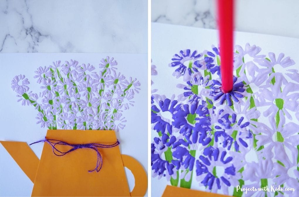 using a straw to paint mini purple flowers