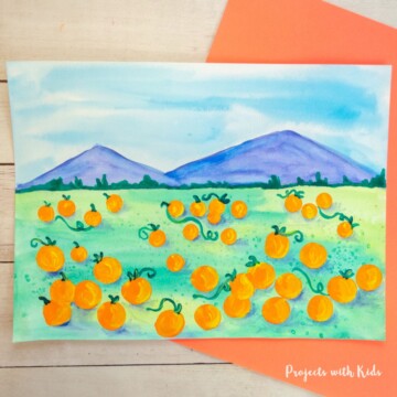Pumpkin patch art project for kids: watercolor pumpkin painting.
