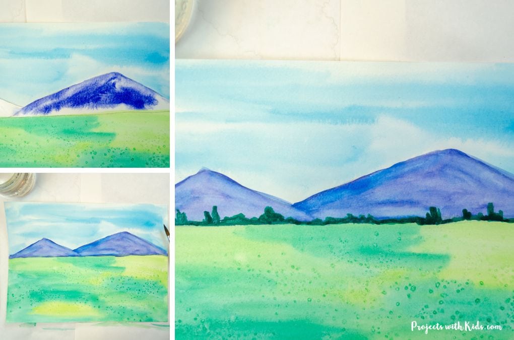 painting in background details using watercolor paint for a pumpkin patch art activity for tweens and teens.