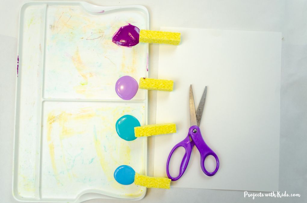 Cut up yellow sponge, acrylic paint, scissors, white cardstock