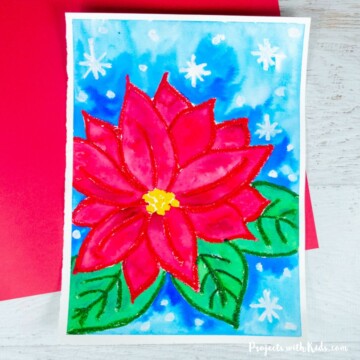 Poinsettia art project for kids to make using watercolor paint and oil pastels.