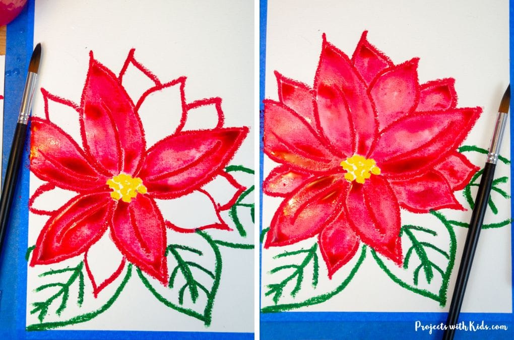 Painting in red petals with watercolor paint for a poinsettia art project tutorial.