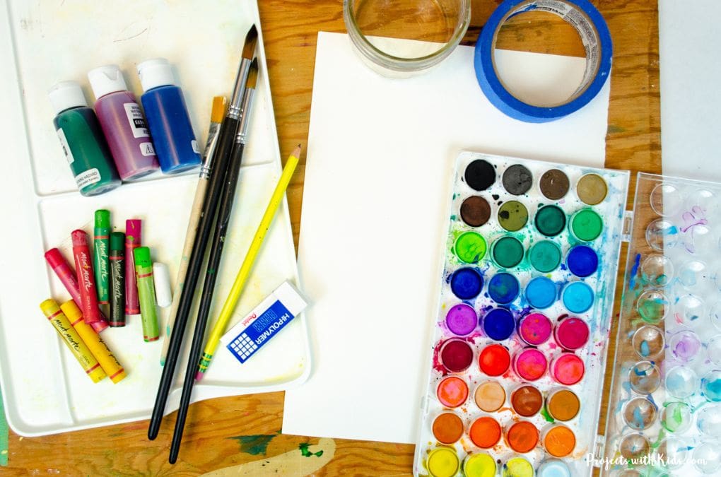 Watercolor painting supplies with oil pastels