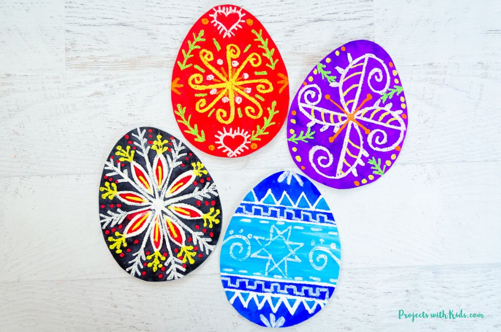 Pysanky art project for kids using watercolor paint and oil pastels.